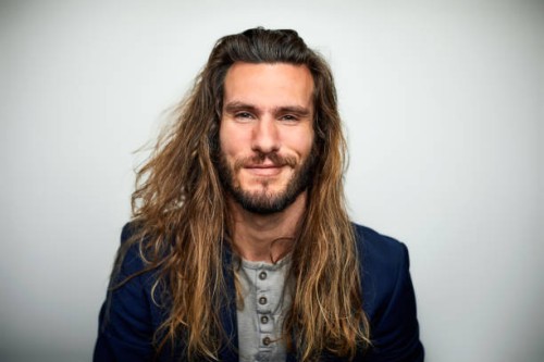 portrait of confident man with long hair - fashion stock pictures, royalty-free photos & images