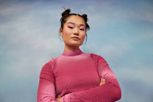 portrait of confident teenage girl with arms crossed against colored background - hairstyle stock pictures, royalty-free photos & images