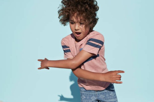 portrait of cool boy dancing, on studio background - fashion stock pictures, royalty-free photos & images