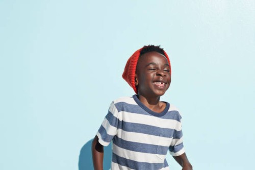 portrait of cool boy laughing , on studio background - fashion stock pictures, royalty-free photos & images