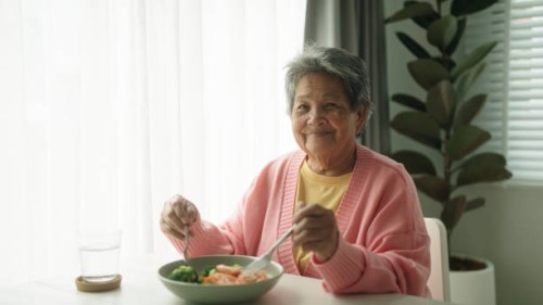 portrait of elderly enjoying healthy food. - food stock pictures, royalty-free photos & images