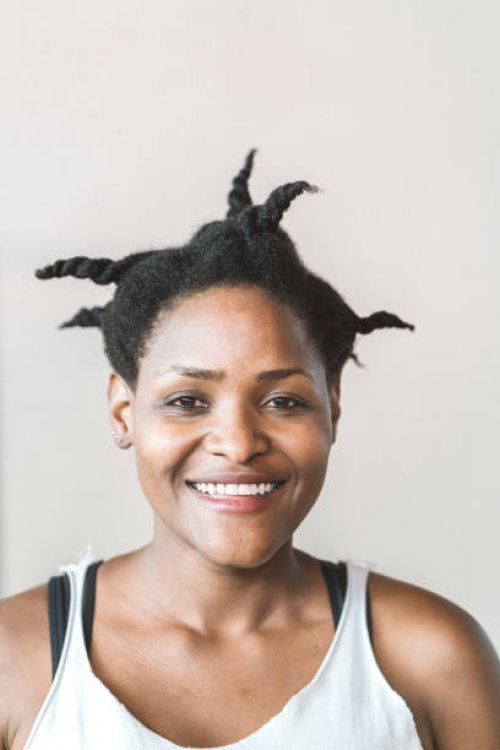 portrait of female athlete smiling and looking into camera - hairstyle stock pictures, royalty-free photos & images