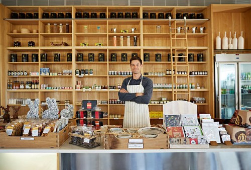 portrait of handsome deli shop owner - home decoration stock pictures, royalty-free photos & images
