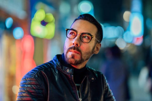 portrait of handsome man lit by neon lights at night - fashion stock pictures, royalty-free photos & images