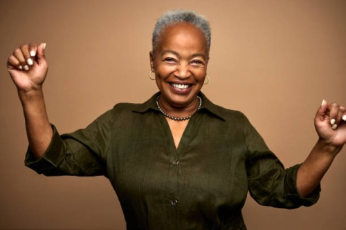 portrait of happy african american senior woman standing with raised arms - fashion stock pictures, royalty-free photos & images
