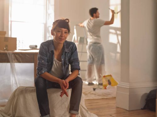 portrait of happy mixed race woman in her new home - home decoration stock pictures, royalty-free photos & images