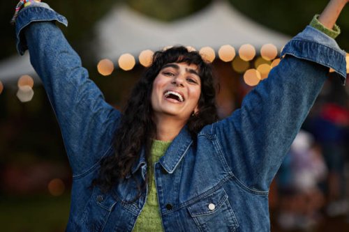 portrait of happy woman dancing to music - concert stock pictures, royalty-free photos & images