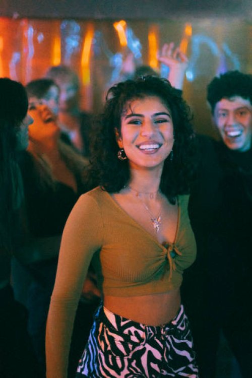 portrait of happy woman with friend dancing in nightclub - concert stock pictures, royalty-free photos & images