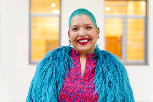 portrait of hispanic lesbian woman with blue dyed hair looking at camera - fashion stock pictures, royalty-free photos & images