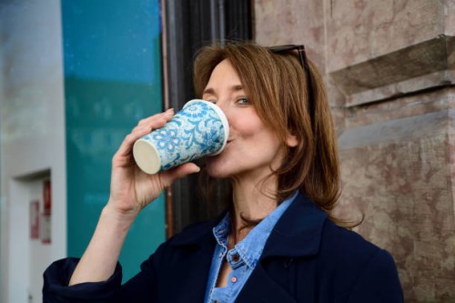 portrait of mature woman drinking from reusable bamboo cup - junk food stock pictures, royalty-free photos & images