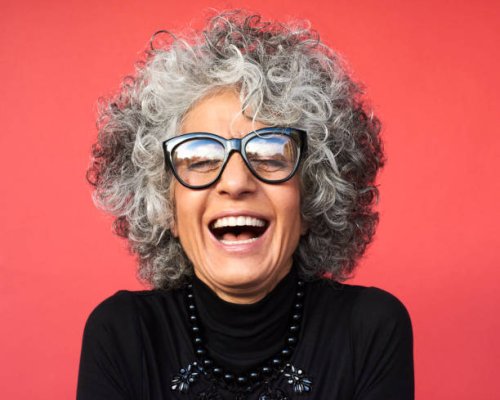 portrait of mature woman laughing - hairstyle stock-fotos und bilder