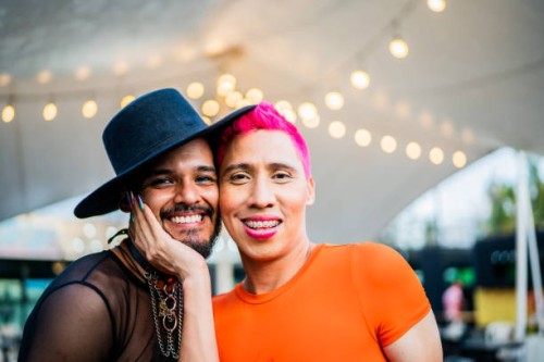 portrait of mid adult gay couple on a festival - concert stock pictures, royalty-free photos & images