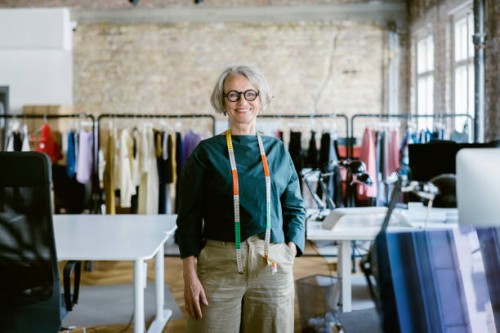 portrait of senior female fashion designer in design studio - fashion stock pictures, royalty-free photos & images