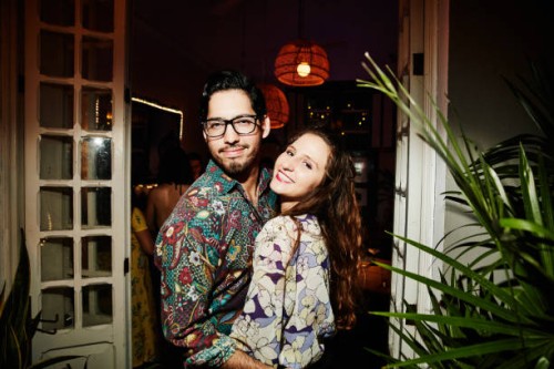 portrait of smiling embracing couple on date in night club - fashion stock pictures, royalty-free photos & images