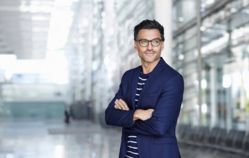 portrait of stylish businessman with stubble wearing blue suit and glasses - fashion stock pictures, royalty-free photos & images