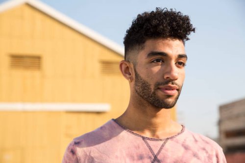 portrait of stylish young man outdoors - hairstyle stock pictures, royalty-free photos & images