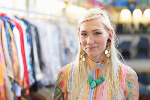 portrait of vintage clothes shop owner. - fashion stock pictures, royalty-free photos & images