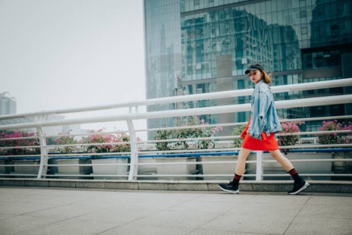 portrait of walking overpass fashion asian woman in city street - fashion stock pictures, royalty-free photos & images