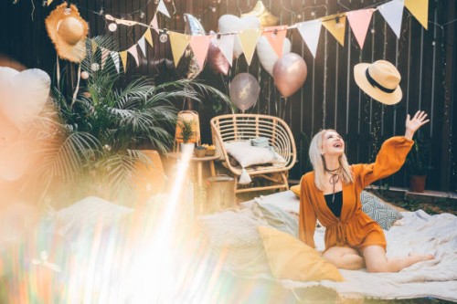 portrait of woman at backyard party. - garden decoration stock pictures, royalty-free photos & images