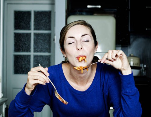 portrait of woman eating spaghetti - food stock pictures, royalty-free photos & images