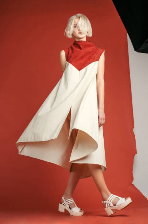 portrait of woman in studio on the red background - fashion stock pictures, royalty-free photos & images