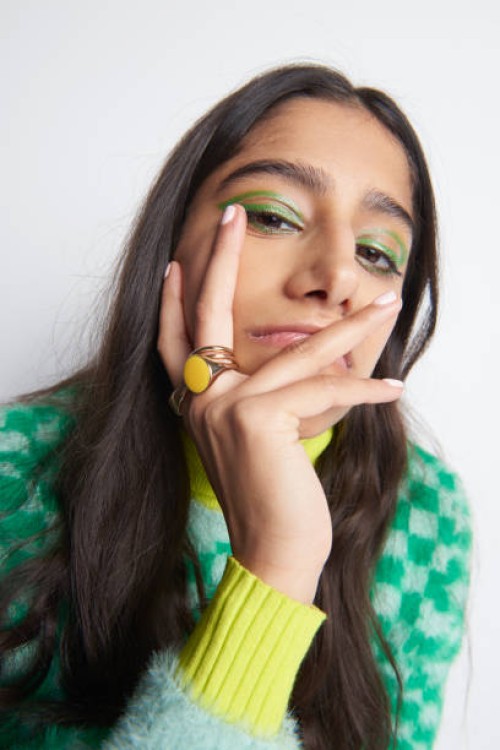 portrait of woman looking defiantly at camera - fashion stock pictures, royalty-free photos & images