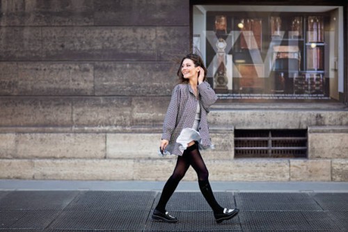 portrait of woman walking on the street and wind blowing her skirt - fashion stock pictures, royalty-free photos & images