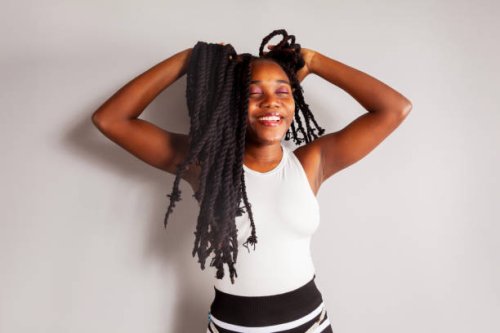 portrait of women touching hair - hairstyle stock pictures, royalty-free photos & images