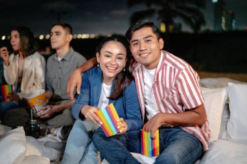 portrait of young couple at the outdoors cinema - concert stock pictures, royalty-free photos & images