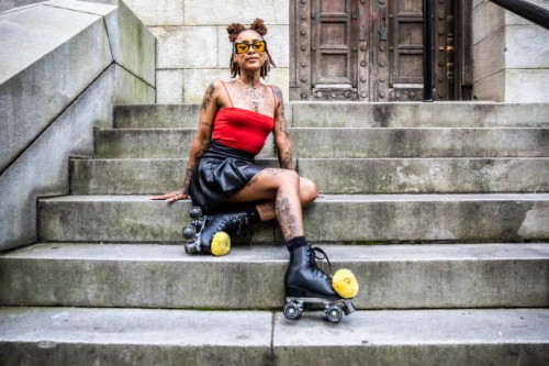 portrait of young female rollerskater in urban area - fashion stock pictures, royalty-free photos & images