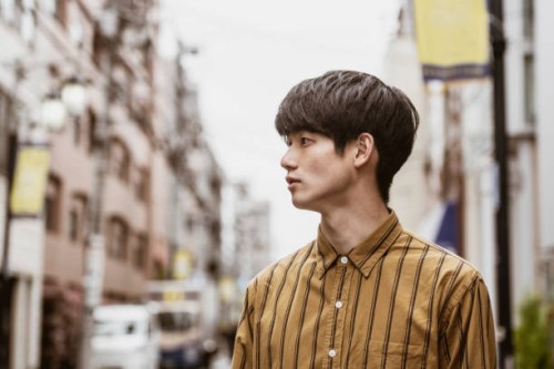 portrait of young japanese man wearing striped shirt - fashion stock pictures, royalty-free photos & images