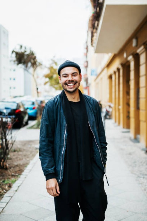portrait of young man going out to meet friends - fashion stock pictures, royalty-free photos & images