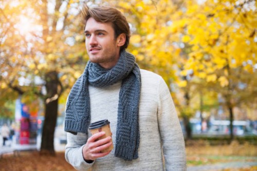 portrait of young man with coffee to go in autumn - junk food stock pictures, royalty-free photos & images