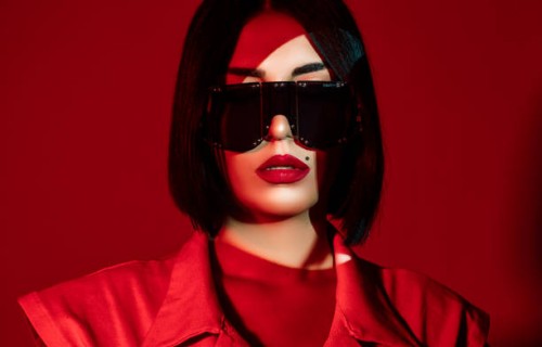 portrait of young photomodel woman with blunt hair in modern sunglasses with dramatic lighting. - fashion stock pictures, royalty-free photos & images