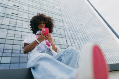 portrait of young stylish generation z girl taken from below. - fashion stock pictures, royalty-free photos & images