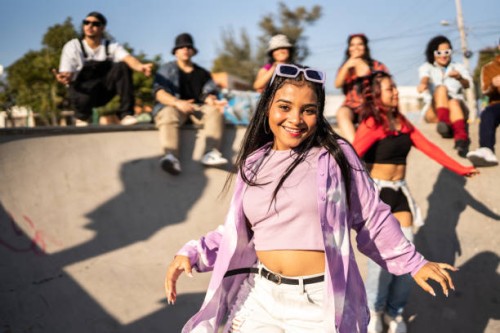 portrait of young woman dancing and having fun at street party - fashion stock pictures, royalty-free photos & images