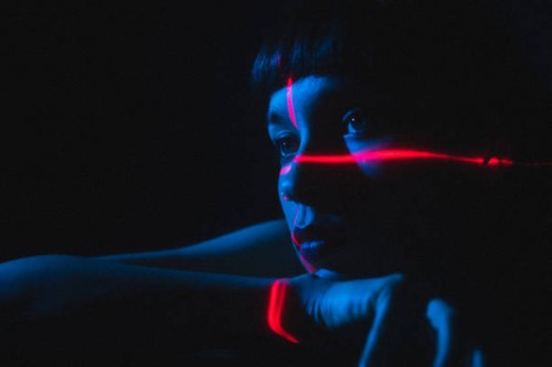 portrait of young woman illuminated neon light and laser - fashion stock pictures, royalty-free photos & images