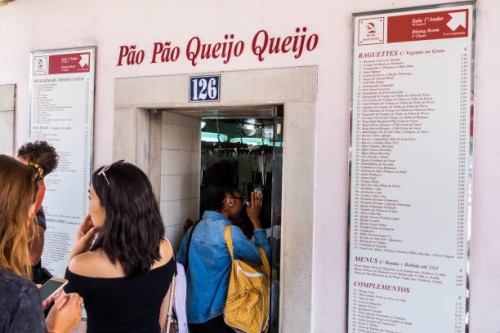 Portugal, Lisbon, Rua de Belem, Pao Pao Queijo Queijo order line at sandwich shop.