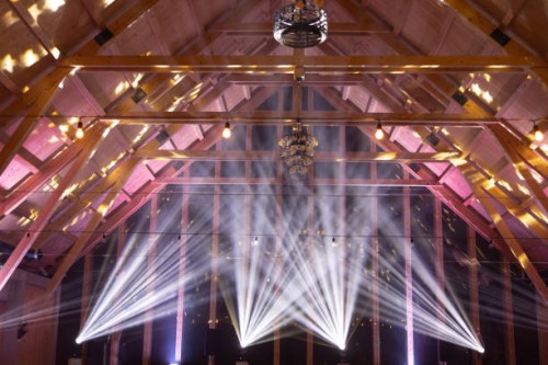 powerful moving light beams on the ceiling structure in the interior of a public event, fashion show, concert or wedding reception. - concert stock pictures, royalty-free photos & images