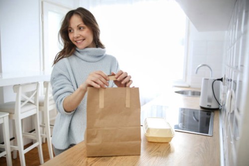 pregnant woman with delivered food - junk food stock pictures, royalty-free photos & images