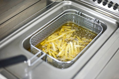 preparing french fries - junk food stock pictures, royalty-free photos & images