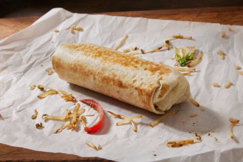 preparing the copycat chinese food burrito - junk food stock pictures, royalty-free photos & images
