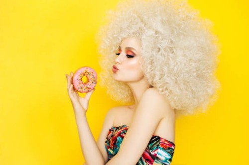 pretty blonde with pink donuts - fashion stock pictures, royalty-free photos & images