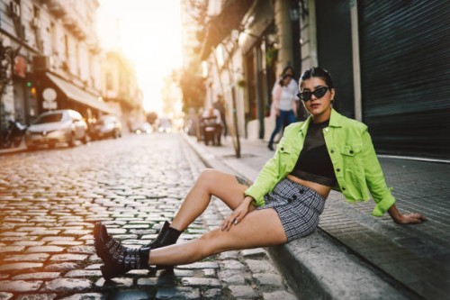 pretty girl sitting in the street - fashion stock pictures, royalty-free photos & images