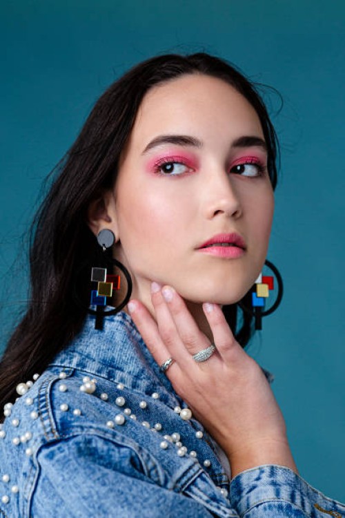pretty young woman wearing jeans jacket - fashion stock pictures, royalty-free photos & images