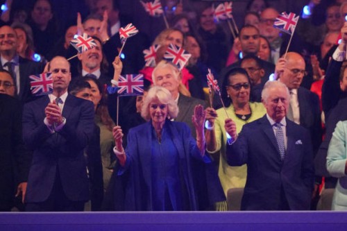 Prince William, Prince of Wales, Queen Camilla and King Charles III in the Royal Box at the Coronation Concert in the grounds of Windsor Castle on...