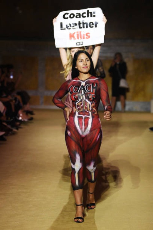 Protesters Model on the runway at the COACH Spring 2024 Ready To Wear Fashion Show and dinner event at the New York Public Library on September 7,...