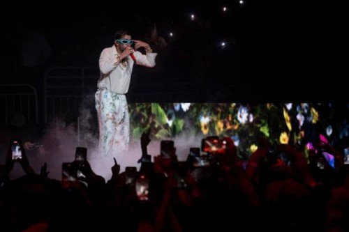 Puerto Rican rapper Bad Bunny performs on stage as part of his three-day "Un Verano Sin Ti" concert at the Coliseo de Puerto Rico in San Juan, Puerto...