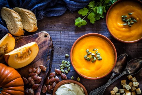 pumpkin soup with ingredients on rustic wooden table - food stock pictures, royalty-free photos & images