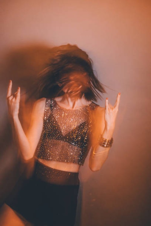 punk rocker chick, punk rock girl making rock hands sign - fashion stock pictures, royalty-free photos & images